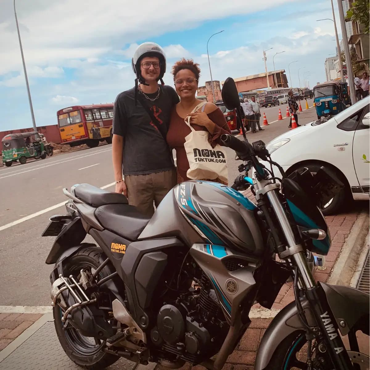 Customers at motorbike handover