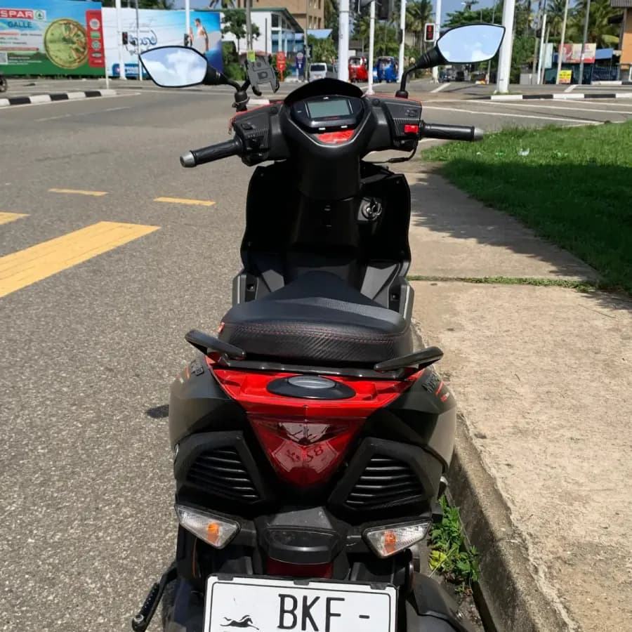 Rear of the scooter showing the fuel cap